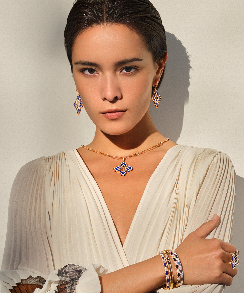 Roberto Coin model wearing sapphire earrings, necklace, and bracelet